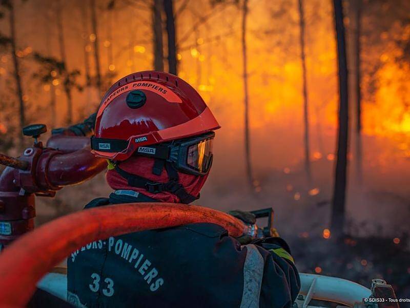 About 2000 firefighters are battling blazes that continue to spread in France's Gironde region.
