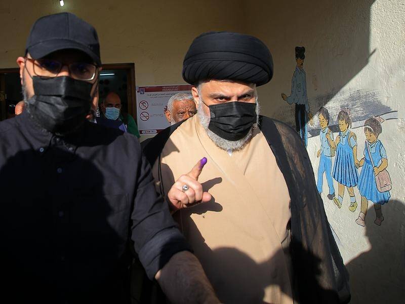 The party of Muqtada al-Sadr (right) has reportedly won more seats in Iraq's parliament.