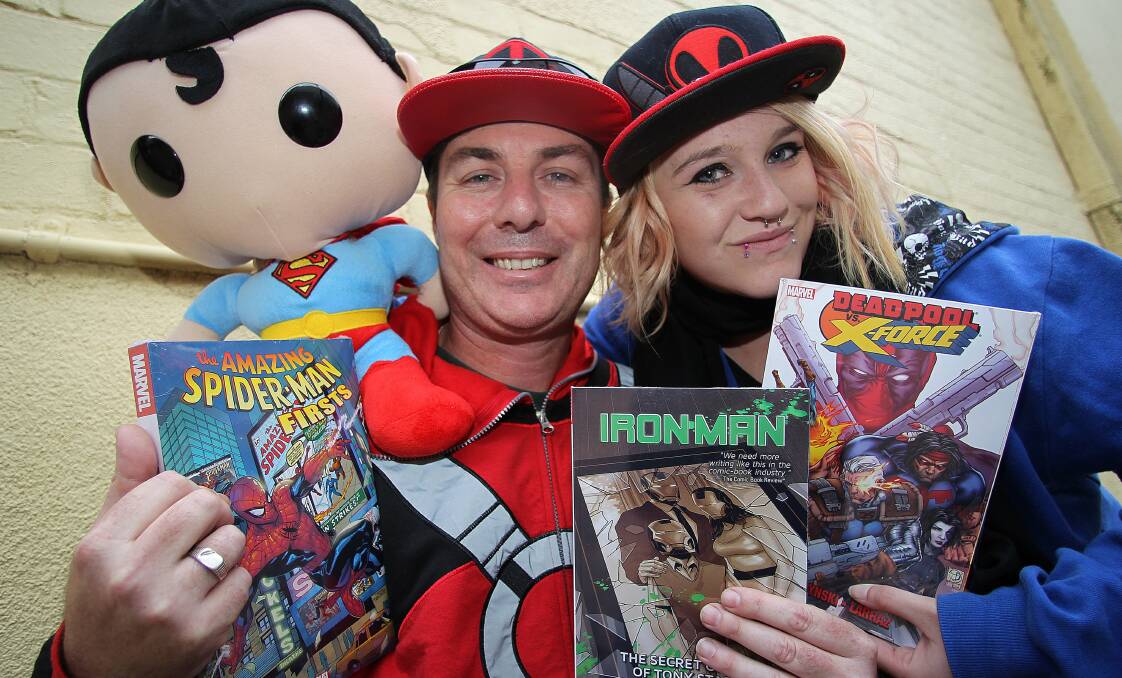 Collectors: Shane Mason, with his daughter Letia, is opening a comic shop inside Wollongong Central.Picture: GREG TOTMAN