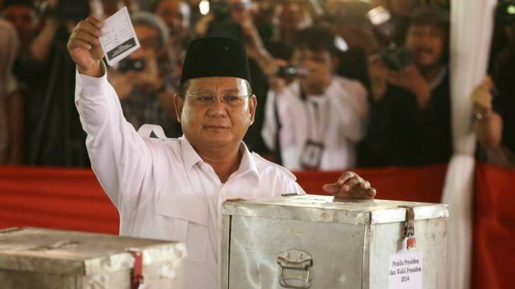Former general Prabowo Subianto shows his ballot paper before voting in the presidential election at a Bojong Koneng polling station in Bogor, Indonesia, on Wednesday. Photo: AP/Achmad Ibrahim