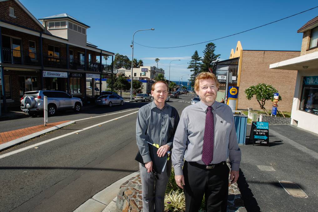 Shellharbour City Council senior  planner Michael Tuffy and acting group manager corporate strategy Trevor James in front of the section of Addison Street, Shellharbour Village, proposed as a pedestrian prioritised environment. Picture: CHRISTOPHER CHAN