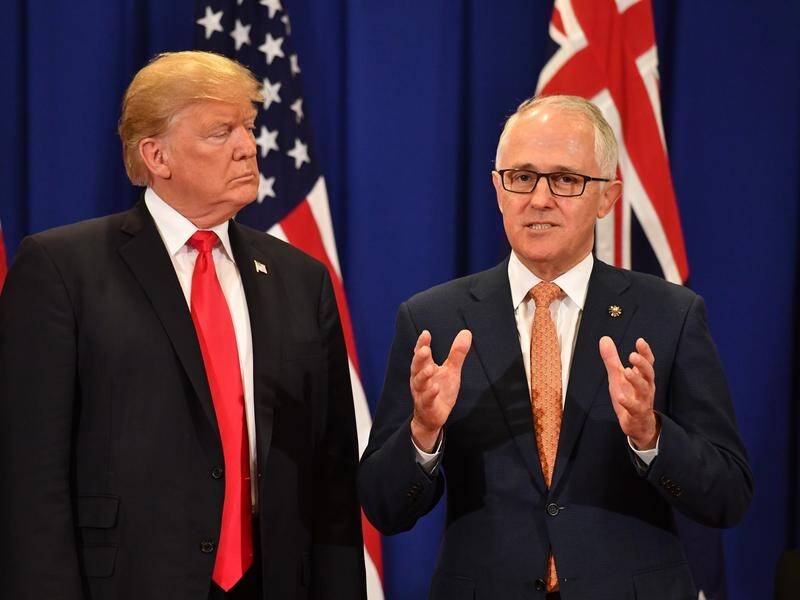 US President Donald Trump listens to Prime Minister Malcolm Turnbull at ASEAN in November 2017.