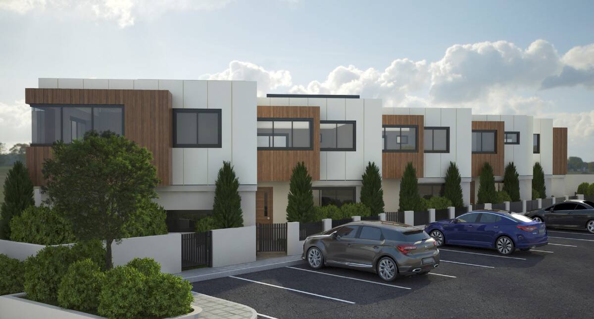 Boutique: An artist's impression of the luxury townhouses to be built on what is now car parking space behind Anita's Theatre at Thirroul.