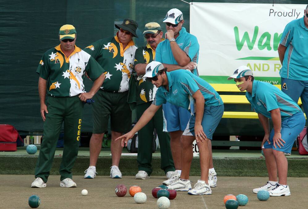 Warilla’s Jesse Noronha,centre, studies an end during the Grade 1 grand final against Dapto Citizens at Warilla Bowling Club. Warilla won 68-56 to claim a fifth Grade 1 flag in seven years. Picture: ROBERT PEET