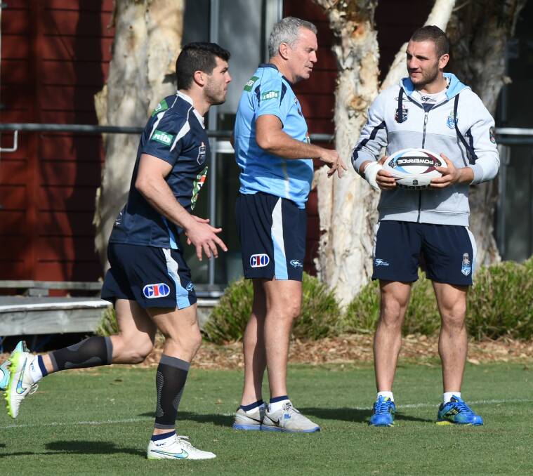 Robbie Farah watches on as his possible replacement in the Blues team, Michael Ennis, trains. Picture: BRENDAN ESPOSITO
