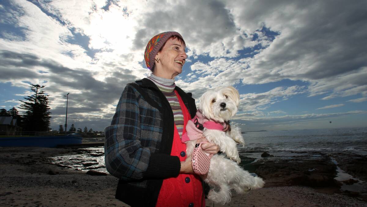 Roslyn O'Dea from Warilla and her pup Lexia enjoying the sunshine at Shellharbour pool. Picture: GREG TOTMAN