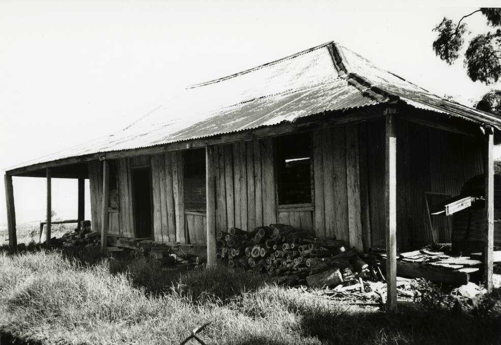 This Kembla Grange settlers hut, built on vertical slate timbers, is typical of what first appeared in the Illawarra.   Picture: From the collections of WOLLONGONG CITY LIBRARY and ILLAWARRA HISTORICAL SOCIETY 