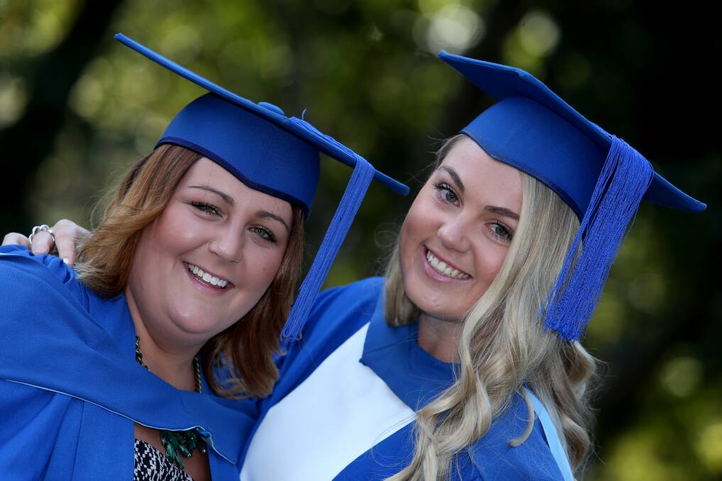 Mates for life: Best friends Haylee Woolsey and Phoebe Thomas at their graduation.Picture: ROBERT PEET