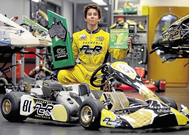 Champion: John Iafolla, 15, with his Australian National Sprint Kart trophy won against the odds.Picture: ROBERT PEET