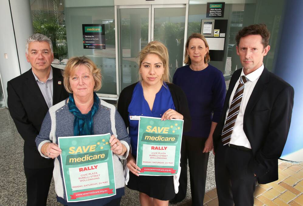 Ready to battle for healthcare: South Coast Labour Council secretary Arthur Rorris, retired nurse Helen Smith, Illawarra Forum's Natalie Mancilla, Cunningham MP Sharon Bird and Throsby MP Stephen Jones outside the Wollongong Medicare offices. Picture: KIRK GILMOUR