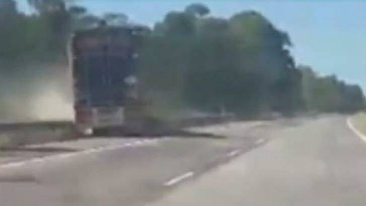 Channel Nine obtained video shot by a young woman of a truck crashing through an embankment on the M1 on Wednesday afternoon. Photo: Channel Nine