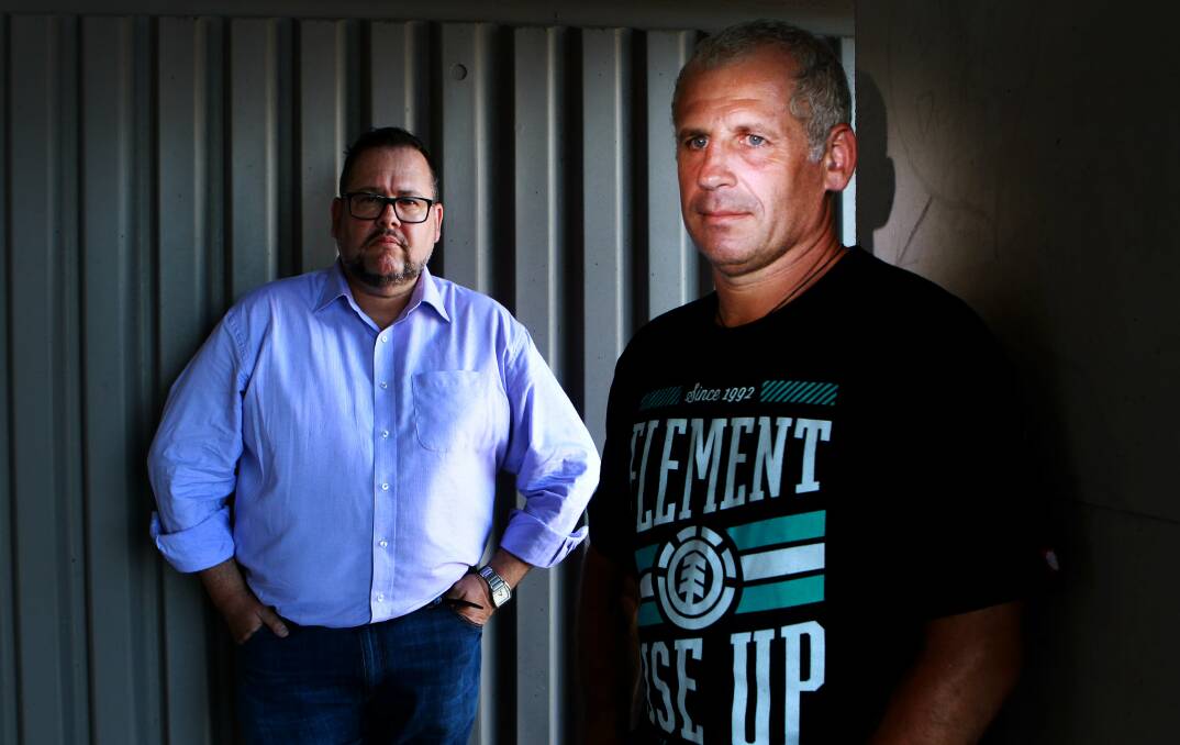 John, a former police officer suffering from PTSD, with his lawyer John Cox. Picture: SYLVIA LIBER