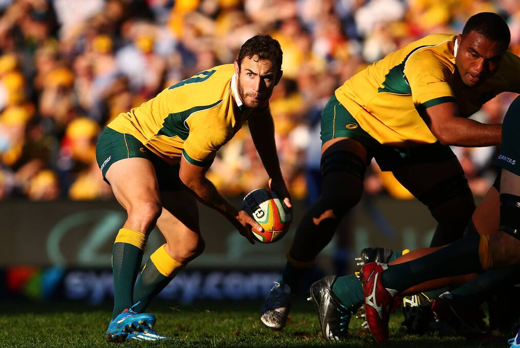 Halfback Nic White clears the ruck for the Wallabies. Picture: GETTY IMAGES