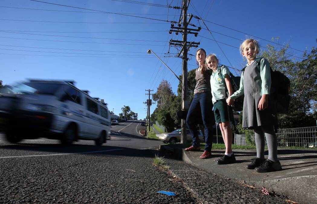 Keiraville P&C president Clair Langford, with daughters Floria, 10, and Georgie, 7. Picture: ROBERT PEET