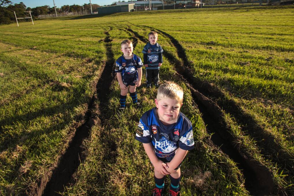 Disappointed: Five-year-olds Rylan Hindle, Kynan Ford and Curtis McWilliams at Lindsay Mayne Oval in Unanderra. Picture: ADAM McLEAN