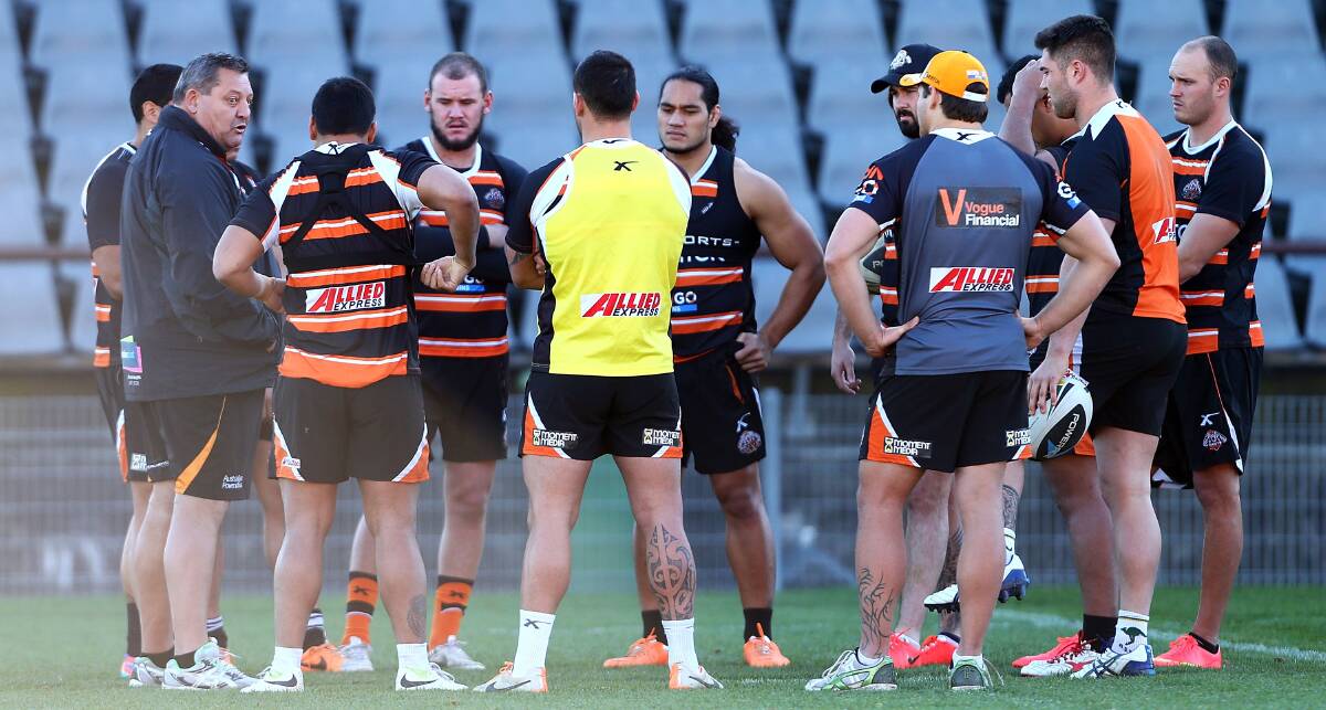 Steve ‘‘Blocker’’ Roach addresses the Wests Tigers players during a training session at Concord Oval on Wednesday.  picture: GETTY IMAGES