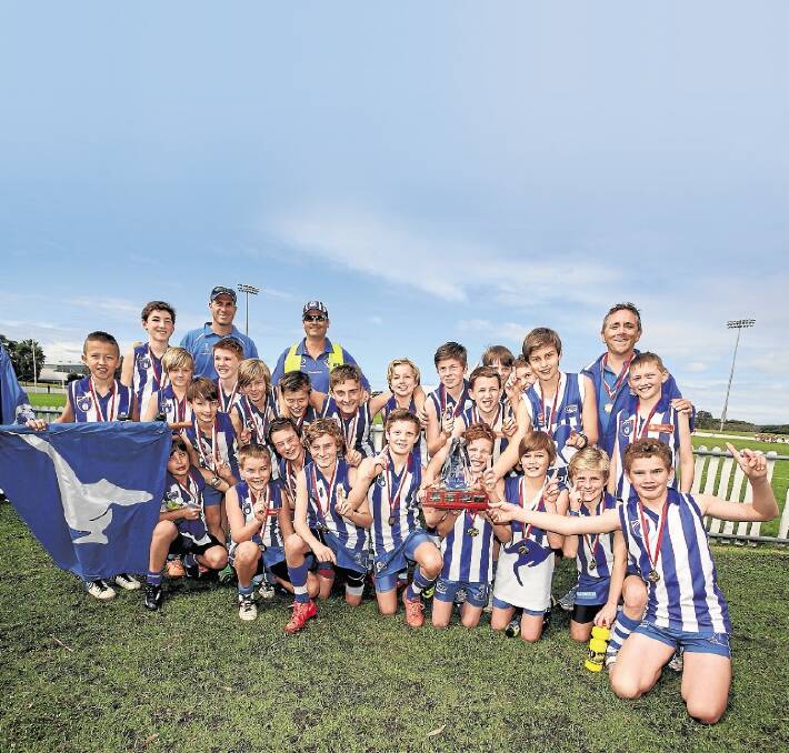 Top team: The Figtree Kangaroos celebrate winning the under-12s Illawarra Junior AFL grand final at North Dalton Park.