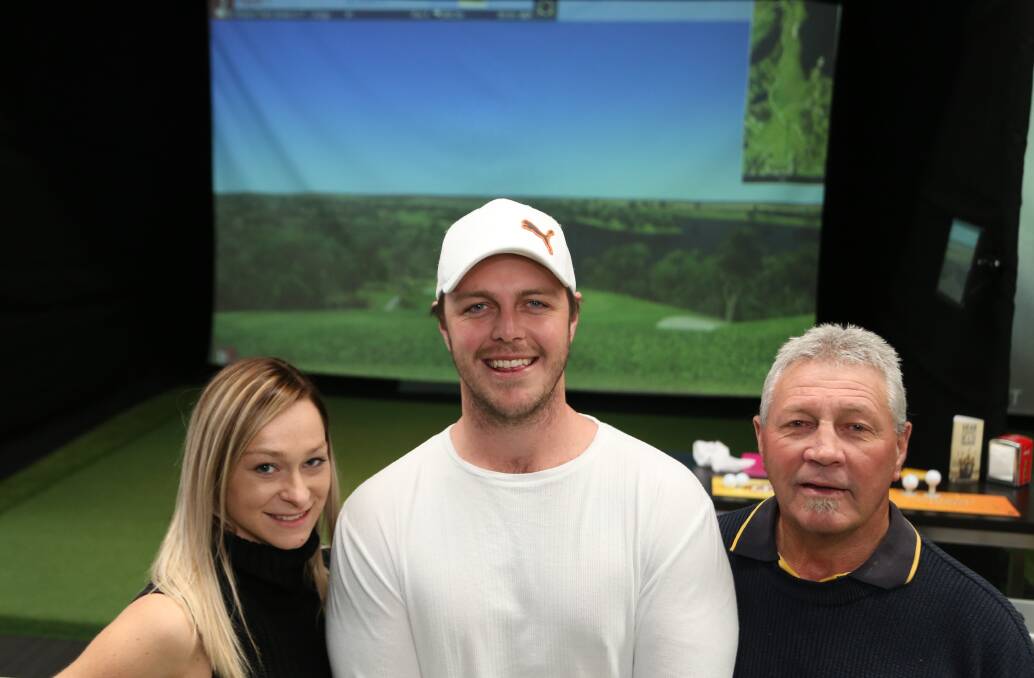 Stroke of fortune: Cassie, Sam and David Cahill at Par-Tee Virtual Golf in Albion Park Rail. Picture: GREG ELLIS