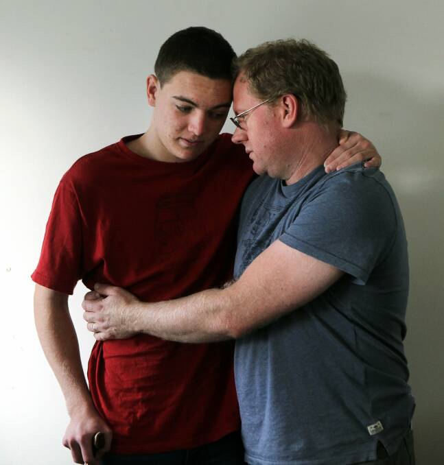 Ben Oakley, who suffers from a one-in-a-million rare neurological disorder, which causes violent body spasms, with his father, Michael. Picture: SYLVIA LIBER