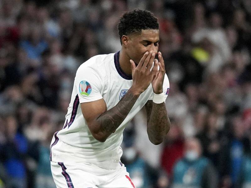 England's Marcus Rashford reacts after missing a shootout penalty as Italy won the Euro championship