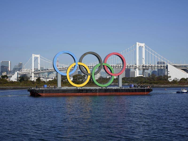 The Olympic rings monument has been returned to its original spot in Tokyo for the Games.