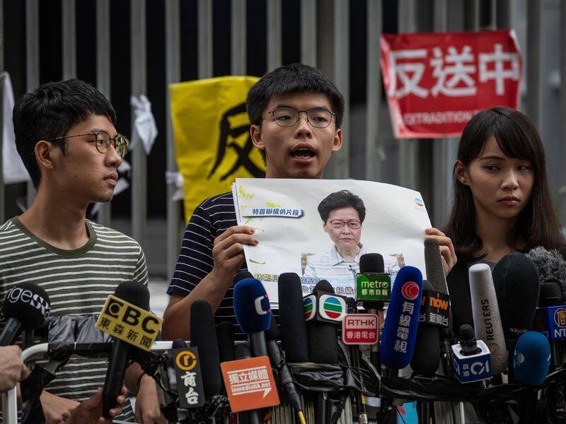 Hong Kong pro-democracy activists Nathan Law, Joshua Wong and Agnes Chow.
