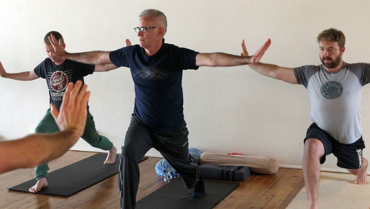 Men strike a pose at one of Vinyasa Yoga's broga classes. Picture: GREG TOTMAN