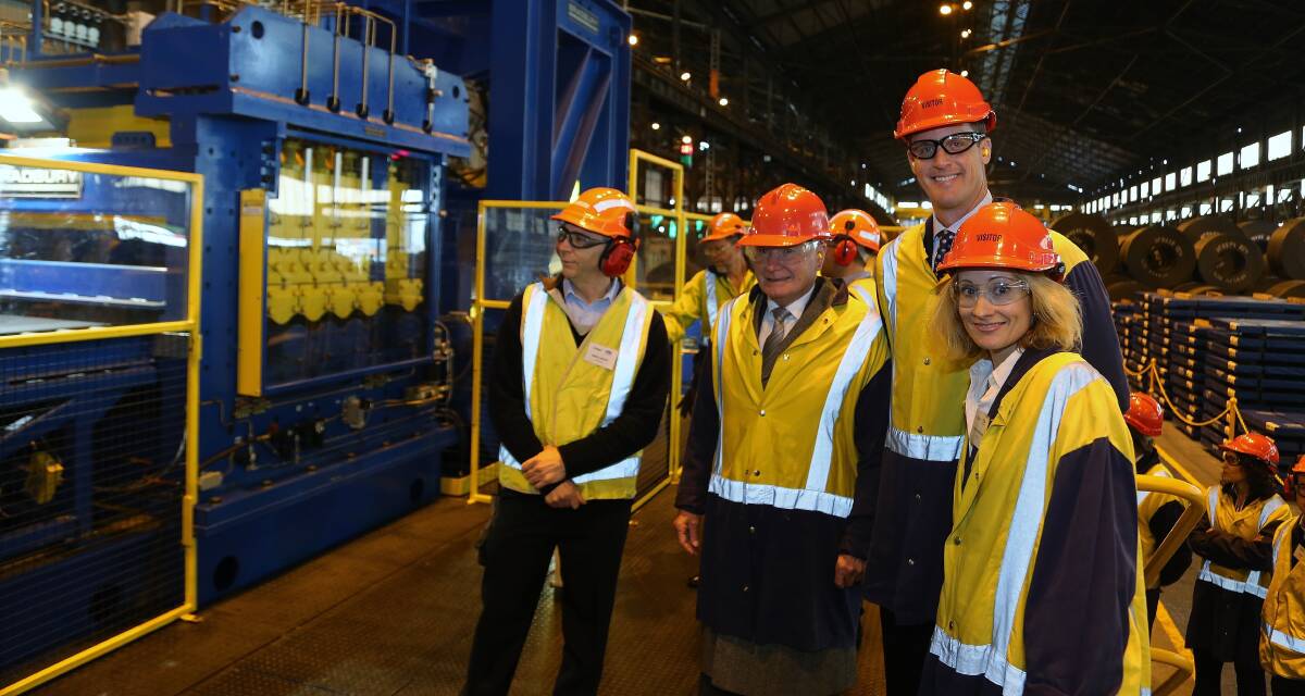  Wollongong Lord Mayor Gordon Bradbery with BlueScope Steel's Jason Ellis and Sarah Deukmeijan watch crew start up the new $8 million hot rolled coil processing facility at Port Kembla Steelworks. Picture: GREG ELLIS