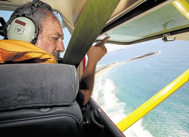 On the lookout: Bendigo Bank Aerial Patrol's Harry Mitchell has issued a shark warning. Picture: PETER RAE