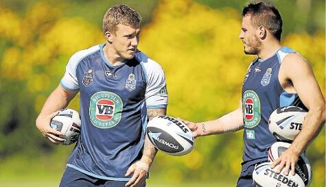 Trent Hodkinson and Josh Reynolds talk tactics during training at Coffs Harbour. Picture: GETTY IMAGES