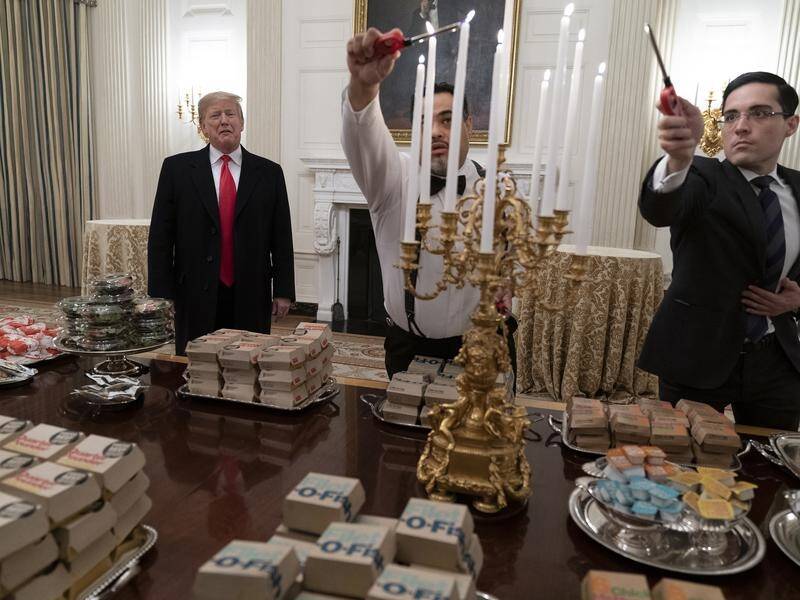 The White House has served fast food to a visiting college team with chefs furloughed.