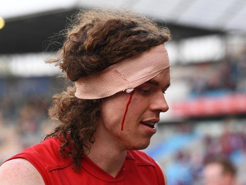 Ben Brown was bloodied but kicked two goals on debut for Melbourne against his former team.