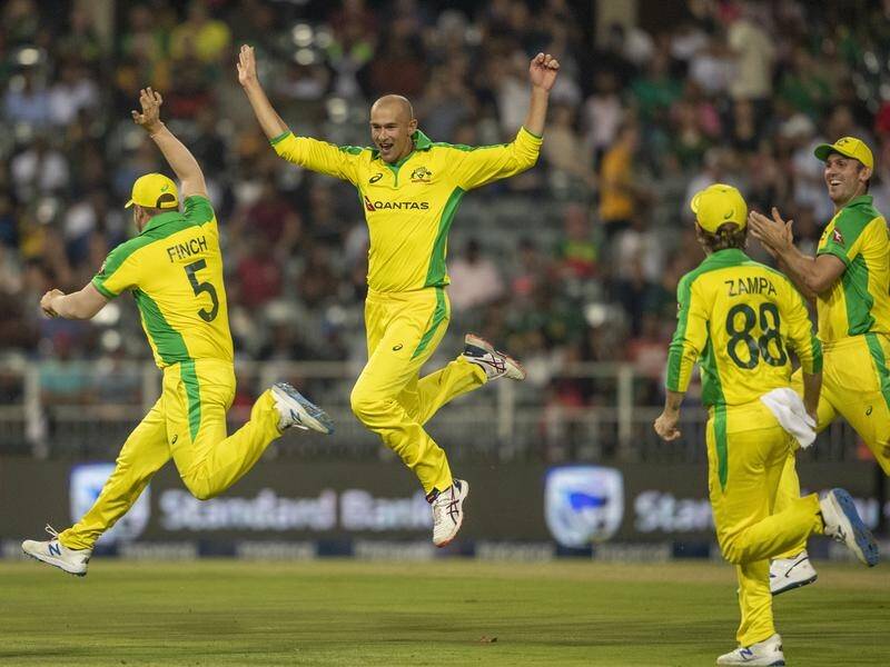 Australia's Ashton Agar, second from left, celebrates his historic T20 hat-trick in South Africa.