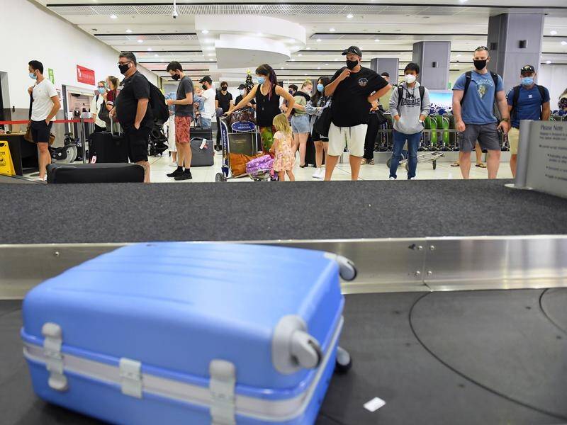 Travellers arrive in Melbourne from Queensland ahead of a three-day lockdown in Brisbane.