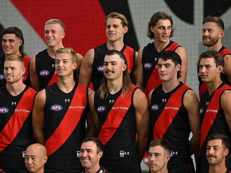 Essendon's Sam Draper (centre) will return to training after having surgery in the AFL off-season. (James Ross/AAP PHOTOS)