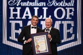 Corey Enright (left) was honoured at the 2023 Hall of Fame ceremony by AFL chairman Richard Goyder. (Julian Smith/AAP PHOTOS)