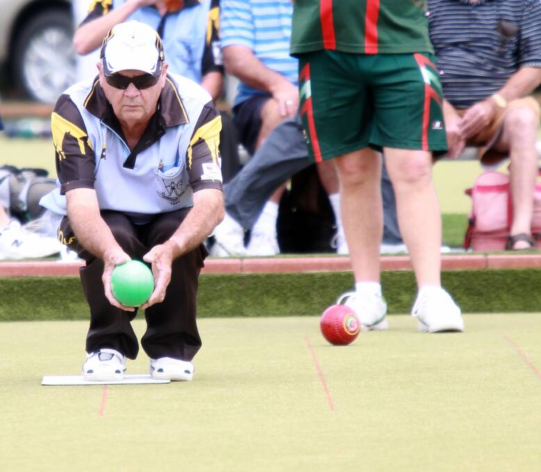 Towradgi skip Lee Reese prepares to bowl in his South Pacific Carnival fours match on Saturday at the Towradgi Bowling Club. Picture: SYLVIA LIBER