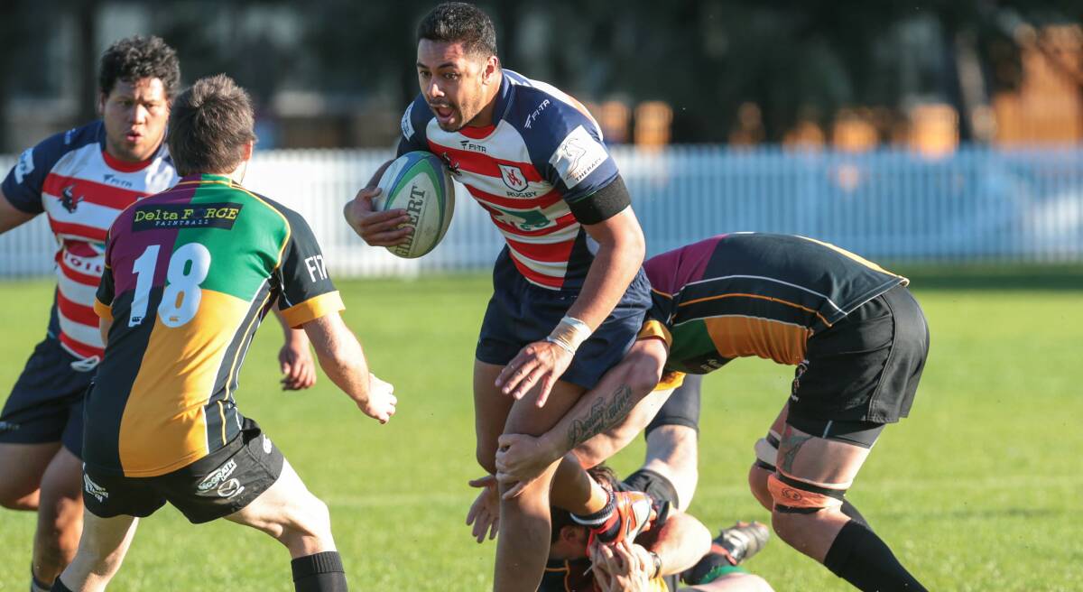 Uni's Sam Latu hits the ball up against Campbelltown at University Oval. Picture: ADAM McLEAN