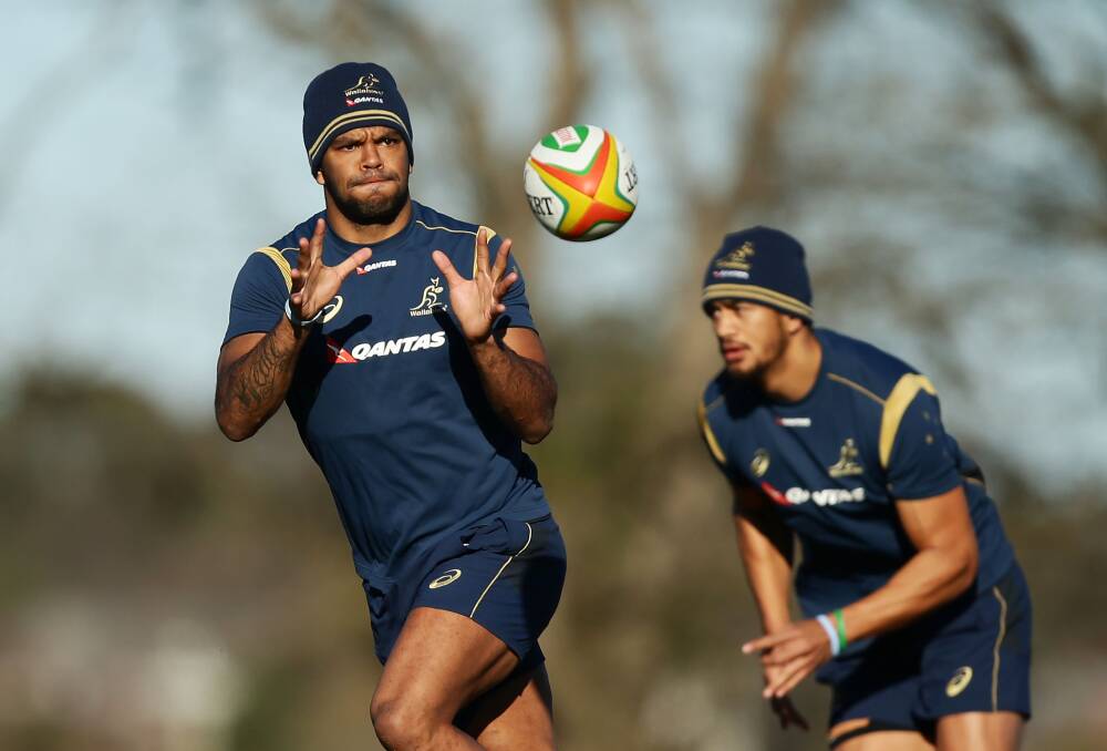  Kurtley Beale receives a pass as Peter Betham supports during a training session in Bathurst. Picture: GETTY IMAGES