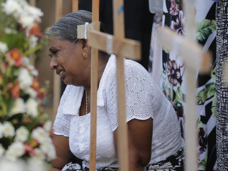Sri Lankans continue to mourn as police round up people for questioning over deadly terror attacks.