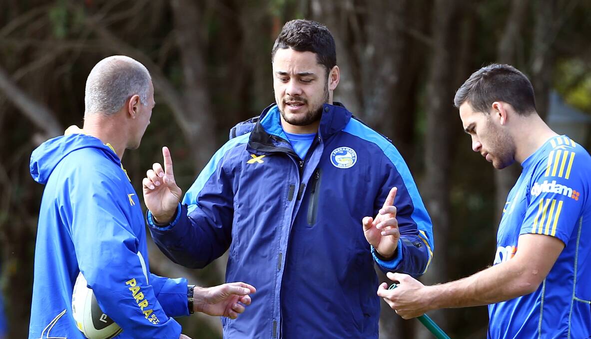 Jarryd Hayne talks to Brad Arthur and teammate Corey Norman at training this week. Picture: GETTY IMAGES