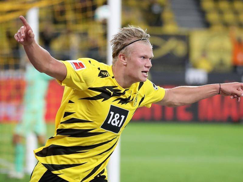 Borussia Dortmund's Erling Haaland scored twice in a 3-0 win over Borussia Moenchengladbach.