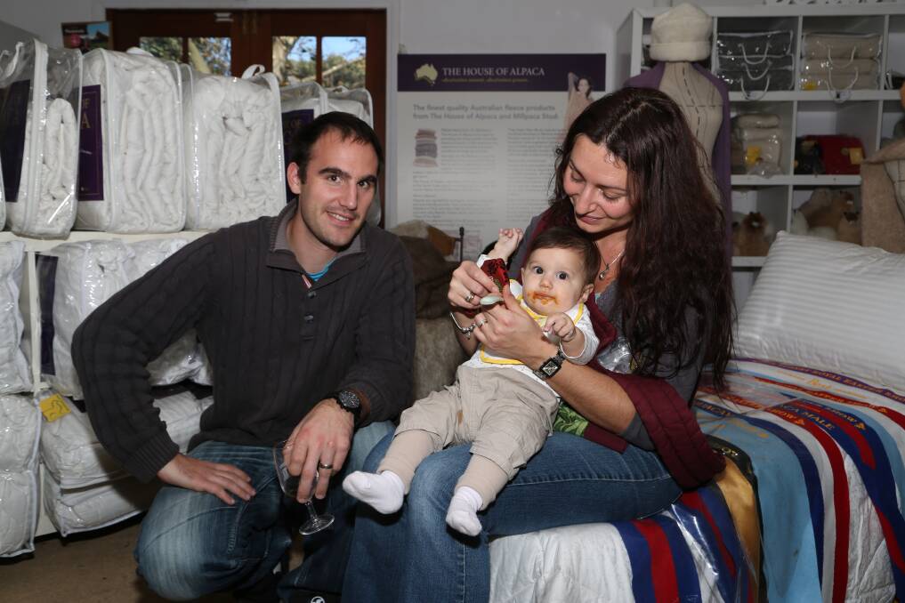 Connoisseurs: Chris, Helene and baby Cloe Deliat, of France, stayed in Gerroa for the weekend and enjoyed the Australian wine, cheese and oysters on offer at the local South Coast wineries. Picture: GREG ELLIS.