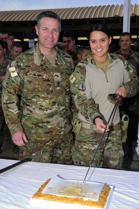 Private Angela Paulo, pictured with Major Micheal Black, will observe her first Anzac Day overseas on Friday.