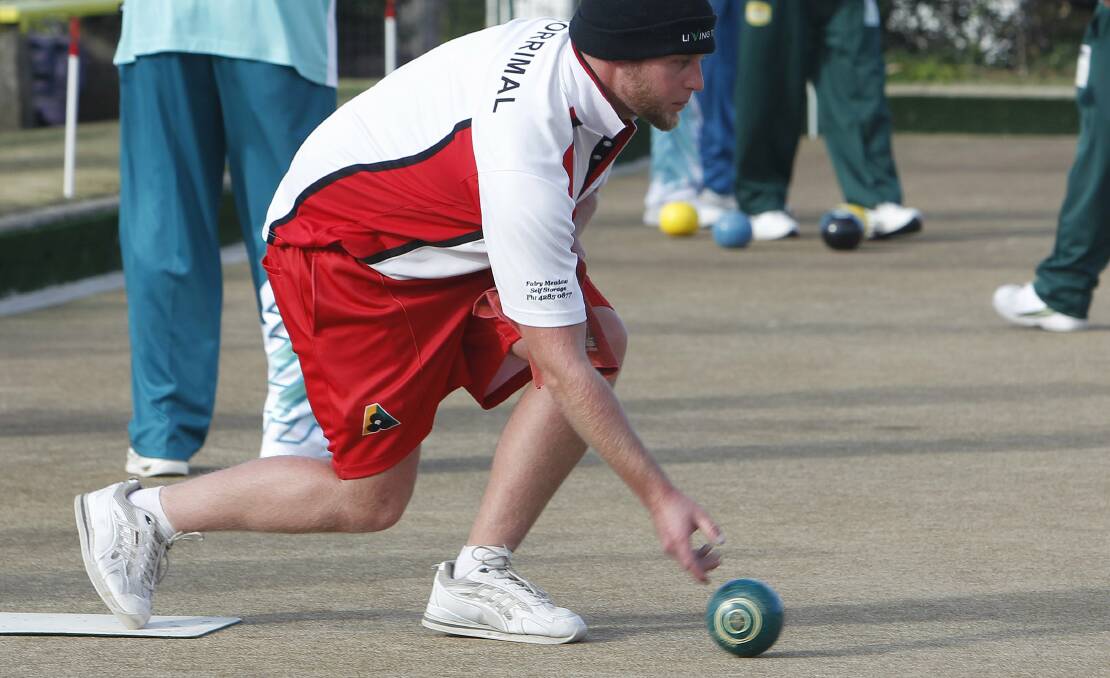 Corrimal skip Reagan Marmont plays his bowl during an early round of the Illawarra Triples Championship at Wiseman Park Bowling Club. Picture: ANDY ZAKELI