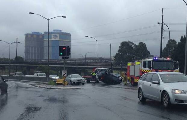 A car flipped onto its roof at Port Kembla on Tuesday. Picture courtesy of Dave Gill.