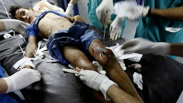 A wounded boy from the Bakr family, receives treatment at al-Shifa hospital, in Gaza City. Photo: AFP