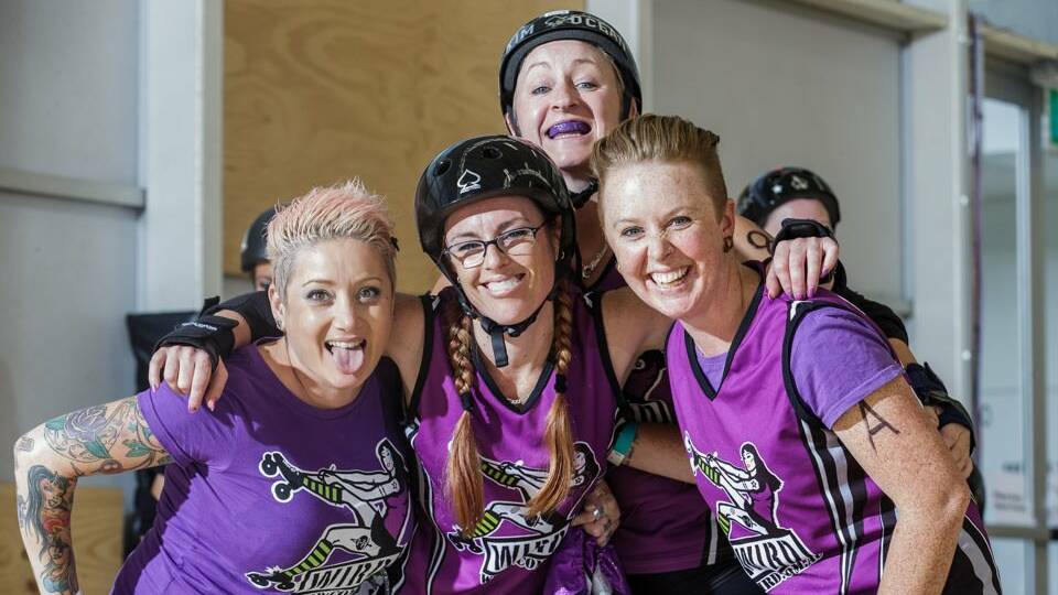 Wollongong Illawarra Roller Derby skaters Tatsue, Ikandy, Mc Slammer and (rear) KimOcean are getting ready for the first co-ed bout in the Illawarra on Saturday. Picture: ROARING STORM PHOTOGRAPHY