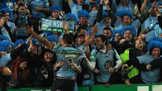 Jarryd Hayne celebrates their win with NSW fans. Photo: Wolter Peeters
