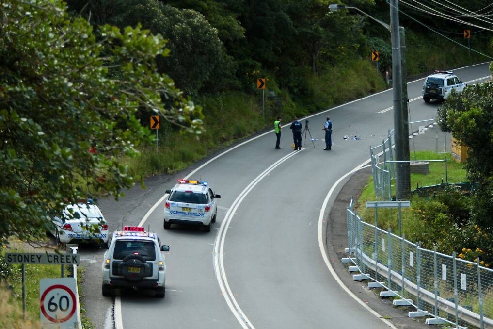 Emergency services at the scene of where a cyclist was hit by a car in Coalcliff on Friday. Picture: ADAM McLEAN